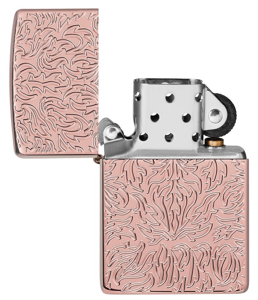 Zippo Carved Armor?« Rose Gold Design Windproof Lighter with its lid open and unlit.